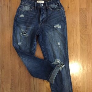 Ripped knee dark wash mom jeans.